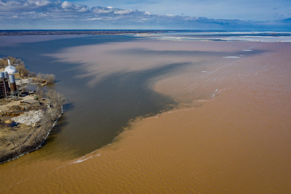 An aerial photo of a sediment bloom at the mouth of the Fox River emptying into Lower Green Bay.